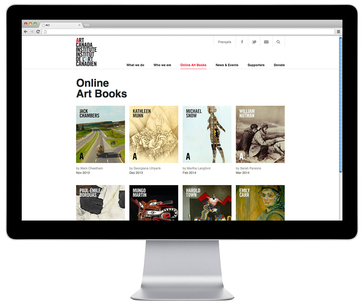 an imac, showing the Art Canada Institute's roster of books including monographs on Jack Chambers, Kathleen Munn, Michael Snow, William Notman, Paul-Emile Borduas, Mungo Martin, Harold Town, and Emily Carr.
