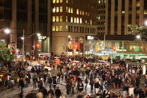 A packed Nathan-Philipps Square during Nuit Blanche. Accompanies Sara Angel's article Three Ways to Navigate Nuit Blanche