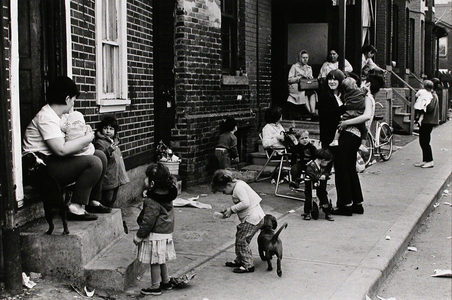 Families on the Sidewalk, Trefann Court (1968) by Ian MacEachern. Gelatin silver print flush mounted to archival board 7 ¼ x 11 inch (18.42 x 27.94 cm) image 11 x 14 inch (27.94 x 35.56 cm) paper/board