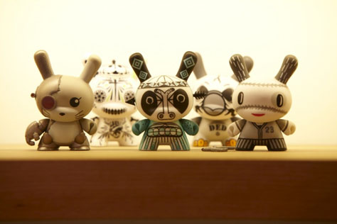 A photo showing a collection of customized KidRobot vinyl figurines in stock at gallery/toy store Magic Pony